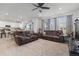 Open living room with a view into the kitchen and comfortable seating at 697 N Bersshine Ct, Watkins, CO 80137
