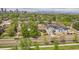 Neighborhood homes with the property nestled among lush greenery, with views of the city skyline at 2539 N York St, Denver, CO 80205