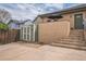 Backyard features a shed, concrete patio, stairs to the house, and mature landscaping at 2539 N York St, Denver, CO 80205