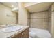 Small bathroom featuring tiled shower, vanity, and modern fixtures at 2539 N York St, Denver, CO 80205