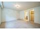 Carpeted bedroom with a light fixture, closet, and bathroom access at 2539 N York St, Denver, CO 80205