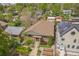 A charming brick home with a meticulously landscaped front yard, featuring flower beds and inviting curb appeal at 2539 N York St, Denver, CO 80205