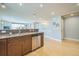 Open-concept kitchen featuring wood floors, stainless steel appliances, and granite countertops at 2539 N York St, Denver, CO 80205