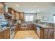 Modern kitchen featuring stainless steel appliances, hardwood floors, and granite countertops at 2539 N York St, Denver, CO 80205