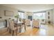 Open floor plan with an elegant dining table near the comfortable living area at 2539 N York St, Denver, CO 80205