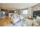 Bright and inviting living room with stylish furniture, a stone fireplace, and natural light at 2539 N York St, Denver, CO 80205