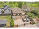 Back of home featuring a patio area, two parking spaces, a fenced yard, and a view of the golf course at 2539 N York St, Denver, CO 80205