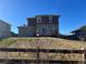 Back exterior view of a two-story home with a deck and a stone facade at 4764 S Duquesne St, Aurora, CO 80016