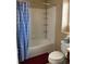 Bathroom with shower/tub, toilet and blue checkered curtain at 4764 S Duquesne St, Aurora, CO 80016