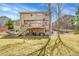 Attractive backyard with a deck, patio, outdoor seating, and lush landscaping, perfect for entertaining at 9411 La Quinta Way, Lone Tree, CO 80124
