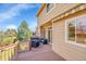 Inviting outdoor deck with comfortable seating and a lovely view, ideal for relaxing and entertaining guests at 9411 La Quinta Way, Lone Tree, CO 80124