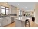 Bright kitchen with stainless steel appliances, kitchen island, and open floor plan at 9411 La Quinta Way, Lone Tree, CO 80124