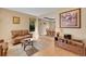 Cozy living room with hardwood floors, neutral walls, and comfortable seating at 9411 La Quinta Way, Lone Tree, CO 80124