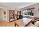 Office with hardwood floors, built-in bookshelves, and a large window for plenty of light at 9411 La Quinta Way, Lone Tree, CO 80124