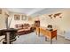 Inviting home office with a large wooden desk, comfortable seating, and a decorative world map on the wall at 9411 La Quinta Way, Lone Tree, CO 80124