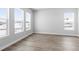 Bright bedroom features 3 large windows and light-colored wood-look floors at 1060 Coal Bank Trl, Castle Rock, CO 80104