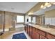 Bathroom with a double sink vanity, large mirror, tiled floors, soaking tub and shower at 5478 Teton Dr, Longmont, CO 80504