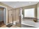 Spa-like bathroom featuring a separate shower and soaking tub at 5478 Teton Dr, Longmont, CO 80504