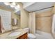 Bathroom featuring a granite counter, a bath and shower combo, and tile flooring at 5478 Teton Dr, Longmont, CO 80504