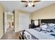 Bedroom showing neutral walls, closet, study desk and chair, and a window with neighborhood views at 5478 Teton Dr, Longmont, CO 80504