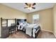 Well-lit bedroom with space for a bed and desk, carpet and a window overlooking the neighborhood at 5478 Teton Dr, Longmont, CO 80504