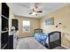 Bedroom with carpet, neutral walls, ceiling fan and window that offers neighborhood views at 5478 Teton Dr, Longmont, CO 80504