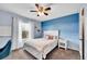 Comfortable bedroom with soft color scheme, ceiling fan, and plush bedding for a relaxing retreat at 5478 Teton Dr, Longmont, CO 80504