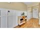 Hallway with a custom dresser and white wainscoting panels at 5478 Teton Dr, Longmont, CO 80504