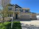 Traditional two-story home with a three-car garage and covered porch at 5478 Teton Dr, Longmont, CO 80504
