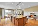 Open concept kitchen with a large center island and modern pendant lighting at 5478 Teton Dr, Longmont, CO 80504