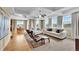 Bright and open living room with coffered ceilings, large windows, and comfortable seating at 5478 Teton Dr, Longmont, CO 80504
