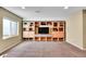 Spacious living room with a built-in entertainment center and large window at 5478 Teton Dr, Longmont, CO 80504