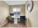 Home office area with a spacious built in desk and natural light from a window at 5478 Teton Dr, Longmont, CO 80504