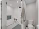 Modern bathroom features a luxurious tub with sleek fixtures and patterned tile flooring at 6574 Olympus Dr, Evergreen, CO 80439