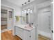 Stylish bathroom with marble countertop, copper sink, pendant lighting, and glass-enclosed shower at 6574 Olympus Dr, Evergreen, CO 80439