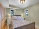 Charming bedroom with wood floors, natural light and ample closet space at 6574 Olympus Dr, Evergreen, CO 80439