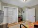 Bright bedroom offers ample storage with built-in shelving and closet space at 6574 Olympus Dr, Evergreen, CO 80439