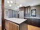 Stylish kitchen featuring stainless steel appliances, custom cabinets, and an island at 6574 Olympus Dr, Evergreen, CO 80439