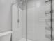 Modern walk-in shower features a sleek design with tiled walls and storage shelving at 6574 Olympus Dr, Evergreen, CO 80439