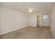 Neutral bedroom with a ceiling fan and a window that brings in natural light at 865 S Quebec St # 103B, Denver, CO 80247