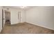 Neutral bedroom showing view of the bathroom and hallway at 865 S Quebec St # 103B, Denver, CO 80247