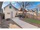 Backyard features include a patio area, grill, and partial privacy fence at 3135 California St, Denver, CO 80205