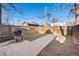 Fenced backyard featuring a paved patio area with a grill, perfect for outdoor entertaining at 3135 California St, Denver, CO 80205