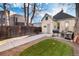 Landscaped backyard with patio space, grill, and privacy fence at 3135 California St, Denver, CO 80205
