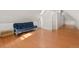 Bedroom featuring hardwood floors, a futon, and lots of natural light at 3135 California St, Denver, CO 80205