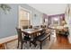 Open-concept dining room with wood floors and access to the living room at 3135 California St, Denver, CO 80205