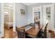 Elegant dining room with hardwood floors and table with seating for six at 3135 California St, Denver, CO 80205