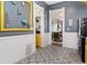 Charming kitchen with patterned flooring, walk in pantry and views to the dining room at 3135 California St, Denver, CO 80205