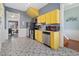 Charming kitchen with stainless steel appliances, patterned floors, and ample counter space at 3135 California St, Denver, CO 80205