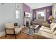 Cozy living room with comfortable seating, fireplace, and bright natural light at 3135 California St, Denver, CO 80205